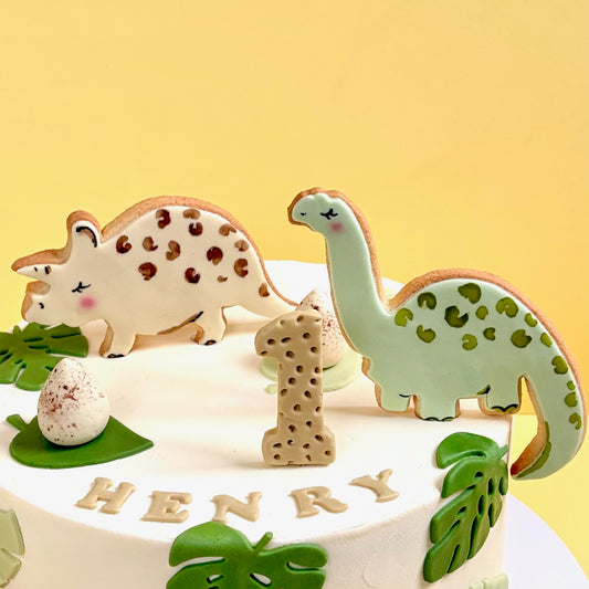Children dinosaur birthday cake with hand painted edible dinosaur decorations