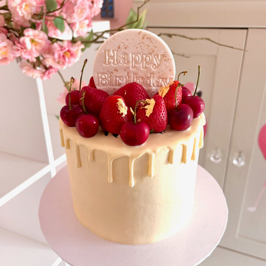Fresh berries and white chocolate drip cake