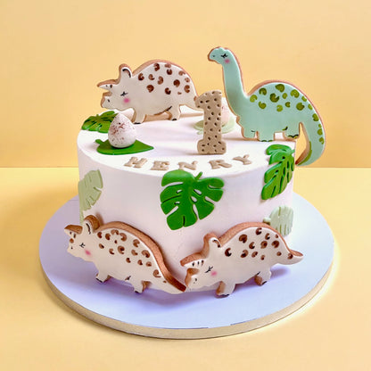 Children dinosaur birthday cake with hand painted edible dinosaur decorations