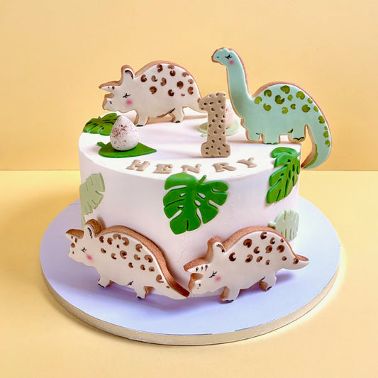 Children dinosaur birthday cake with hand painted edible dinosaur decorations
