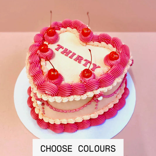 Vintage heart buttercream cake with cherries decoration