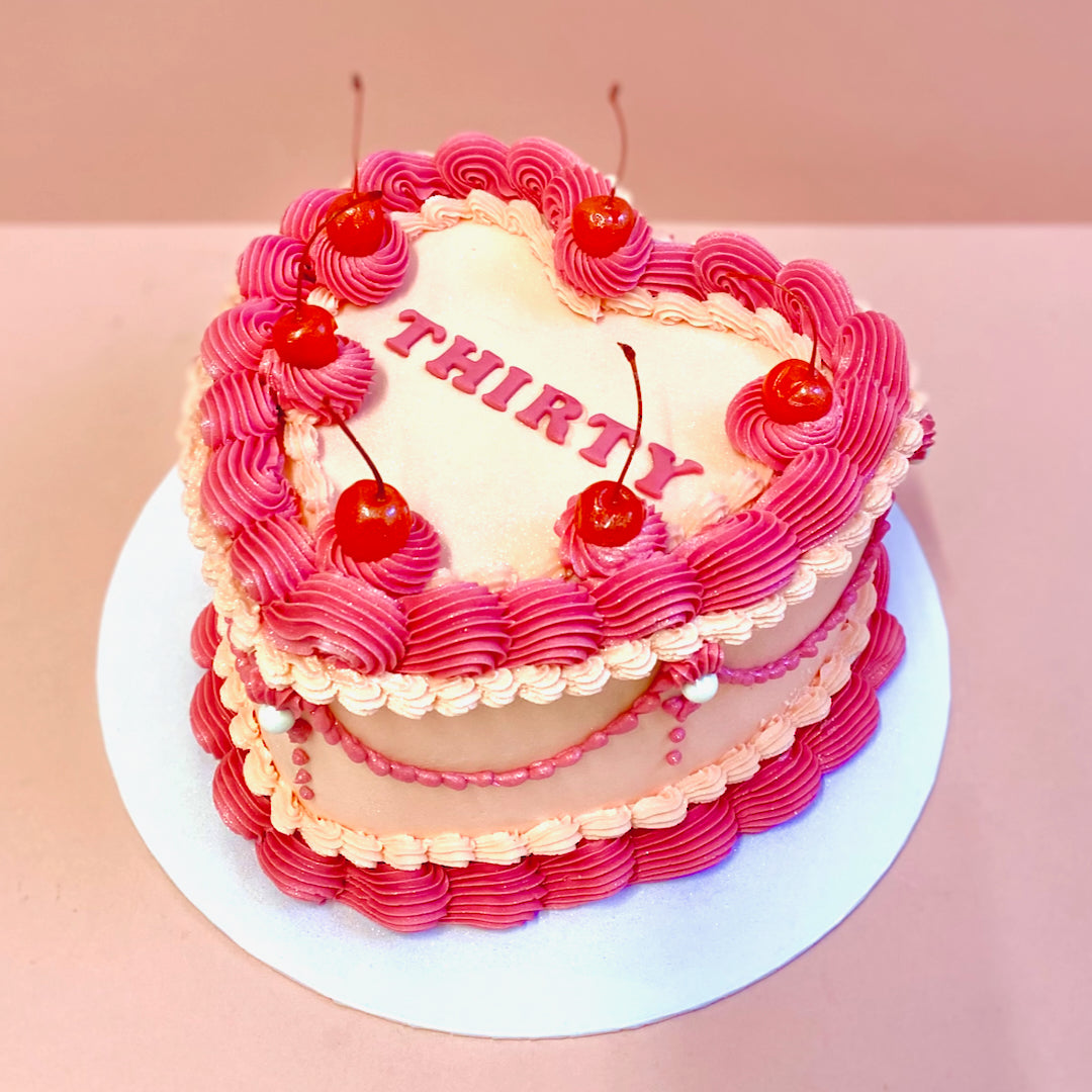 Vintage heart buttercream cake with cherries decoration